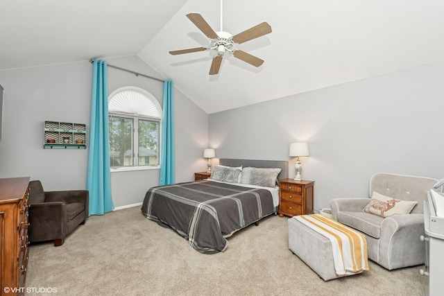 carpeted bedroom featuring ceiling fan and vaulted ceiling