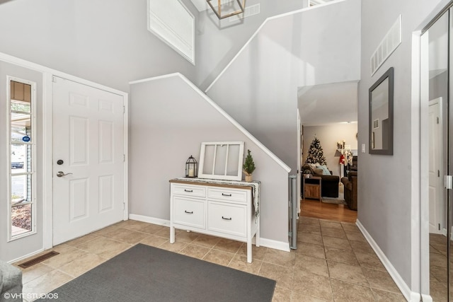 entryway with light tile patterned floors