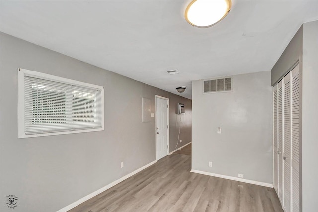 unfurnished bedroom featuring light hardwood / wood-style flooring