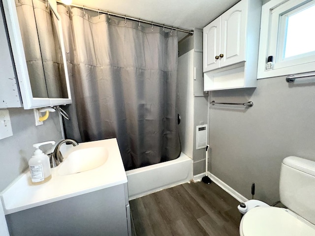 full bathroom with vanity, wood-type flooring, shower / tub combo, and toilet