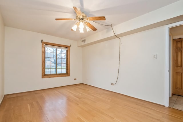 unfurnished room with ceiling fan and light wood-type flooring