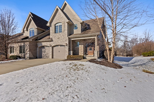 french provincial home with a garage