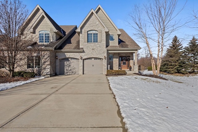 french country inspired facade featuring a garage