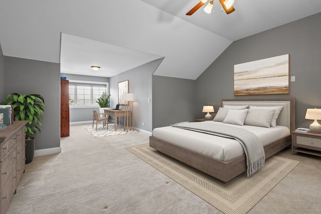 carpeted bedroom with ceiling fan and lofted ceiling