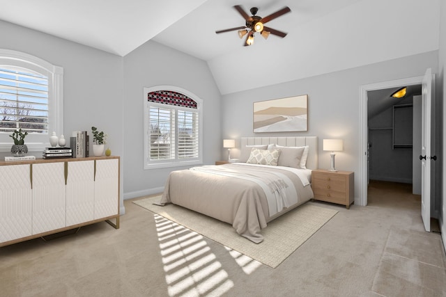 carpeted bedroom featuring ceiling fan and lofted ceiling