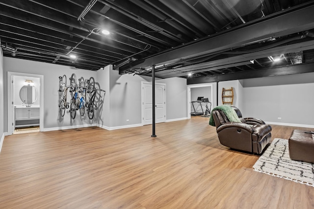 basement featuring light hardwood / wood-style floors