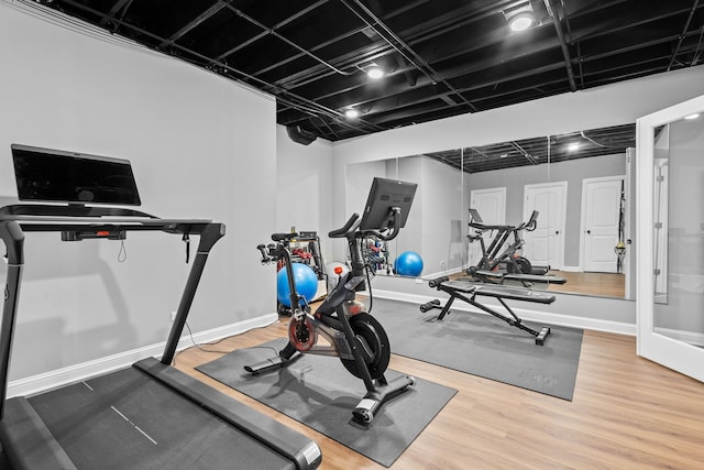 workout room with wood-type flooring