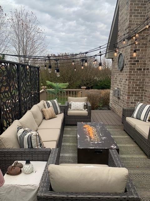 view of patio featuring an outdoor living space with a fire pit and a deck