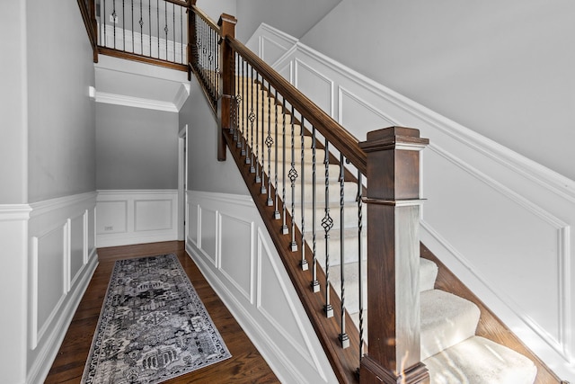 stairway with hardwood / wood-style floors