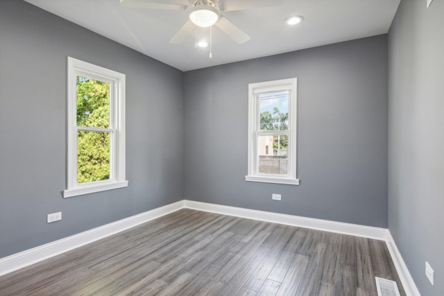 empty room with wood-type flooring and ceiling fan