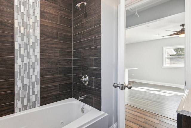 bathroom featuring hardwood / wood-style flooring and tiled shower / bath