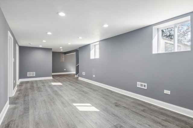 basement featuring hardwood / wood-style floors