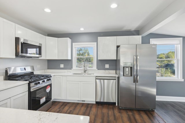 kitchen featuring white cabinetry, sink, and stainless steel appliances