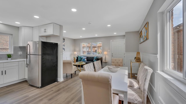 dining room with light hardwood / wood-style floors