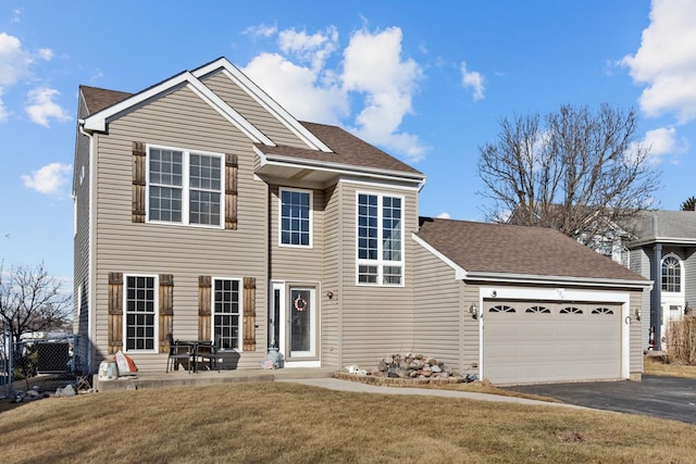 view of front of house featuring a garage and a front yard