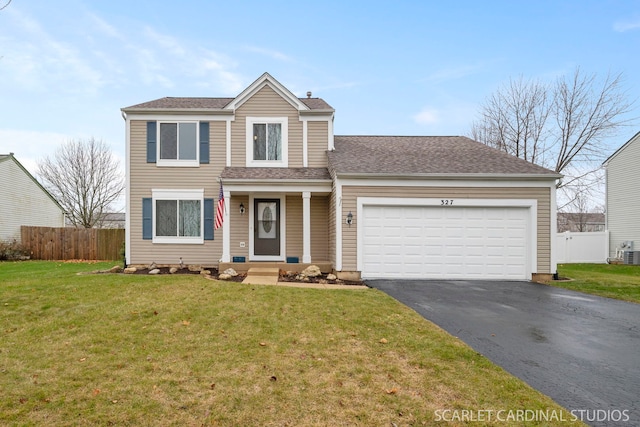 front of property featuring a garage and a front lawn