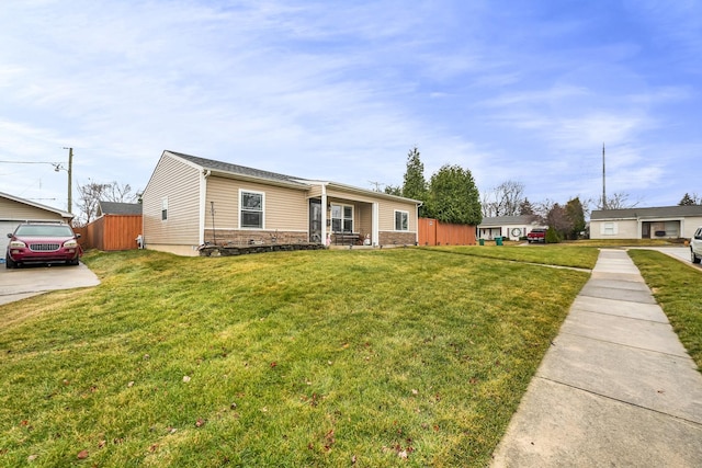 single story home with a front lawn