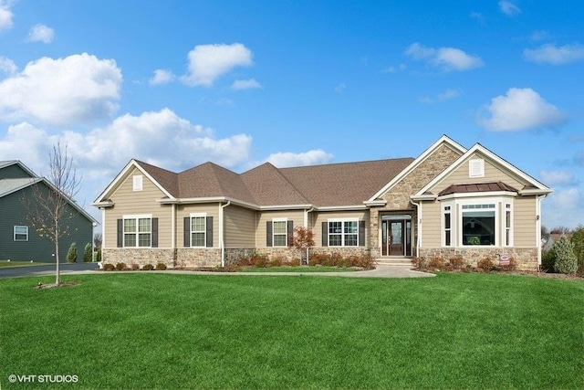 craftsman-style house with a front lawn