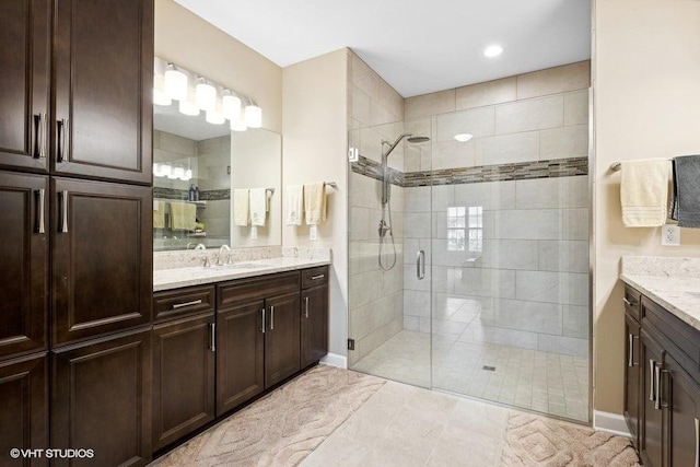 bathroom with vanity and walk in shower