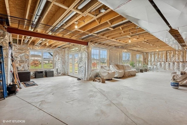 misc room featuring plenty of natural light and concrete flooring