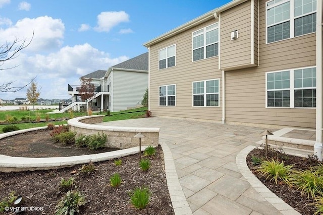 back of house featuring a patio area