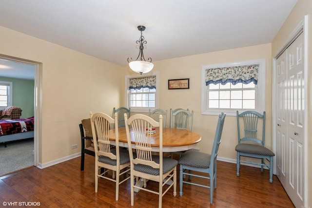 dining area with dark hardwood / wood-style floors