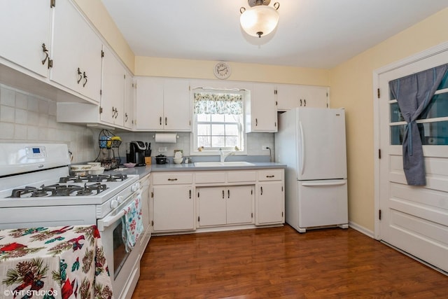 kitchen featuring white appliances, dark wood-type flooring, tasteful backsplash, white cabinetry, and sink