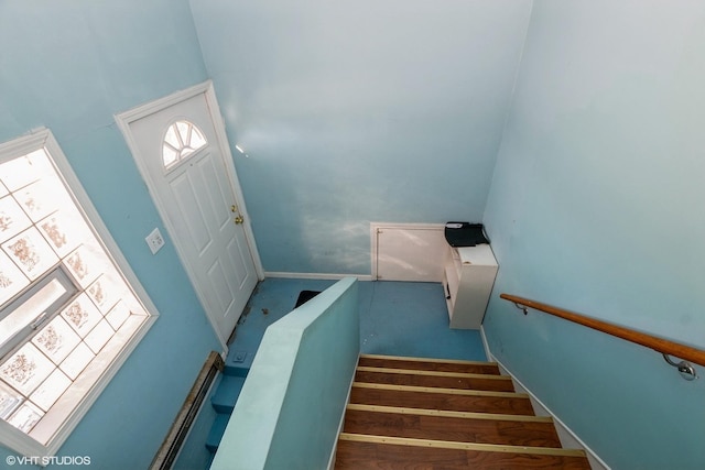 stairs featuring a high ceiling