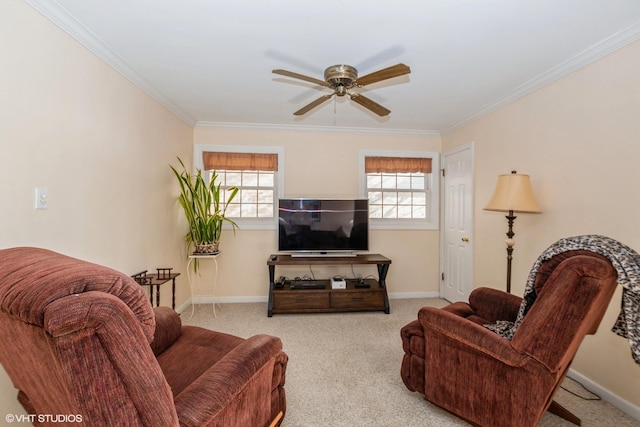 living room with ceiling fan, crown molding, and light carpet