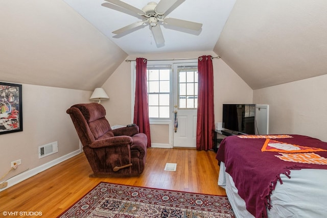 bedroom with lofted ceiling, ceiling fan, and light hardwood / wood-style floors