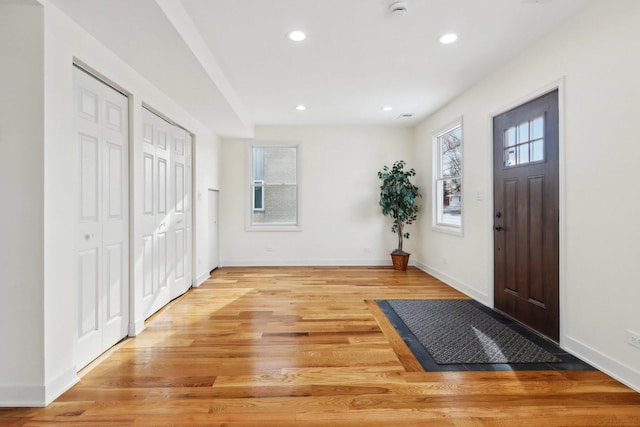 entrance foyer with light hardwood / wood-style flooring