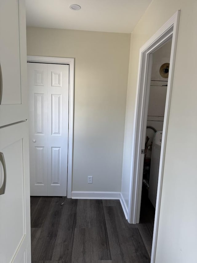 hallway featuring dark wood-type flooring