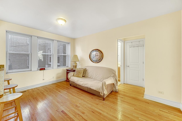 sitting room with hardwood / wood-style floors