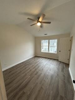 empty room featuring dark hardwood / wood-style flooring and ceiling fan