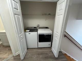 laundry room featuring washing machine and clothes dryer