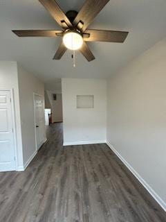 empty room with dark hardwood / wood-style floors