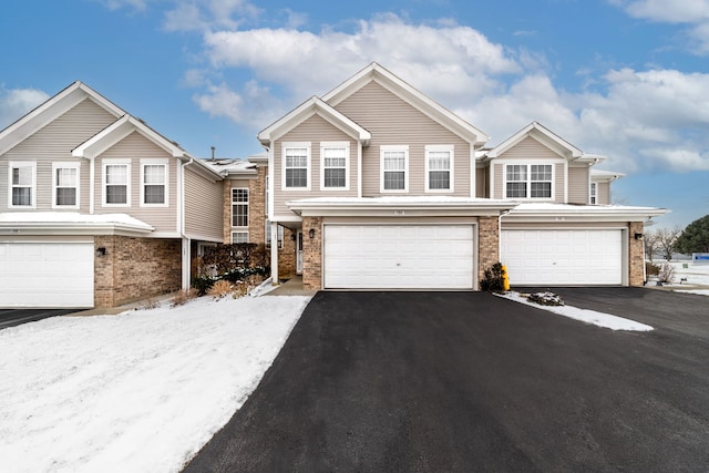 townhome / multi-family property featuring a garage