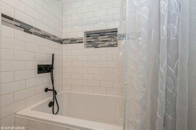 bathroom with shower / bath combination with curtain