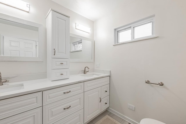 bathroom with tile patterned flooring and vanity