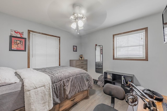 bedroom featuring ceiling fan and wood-type flooring