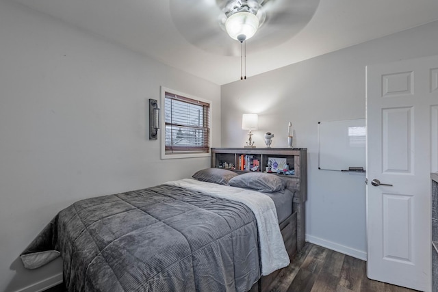 bedroom featuring ceiling fan and dark hardwood / wood-style flooring