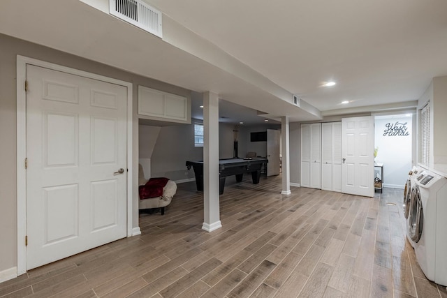 washroom with independent washer and dryer, light hardwood / wood-style floors, and pool table