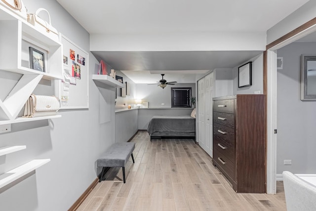 bedroom with ceiling fan and light wood-type flooring