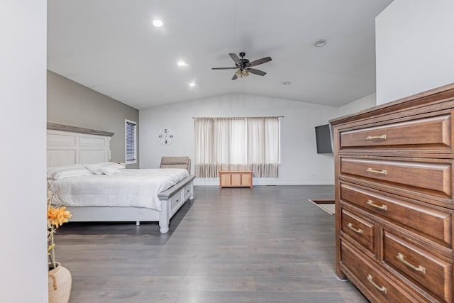 bedroom with vaulted ceiling, ceiling fan, and dark hardwood / wood-style floors