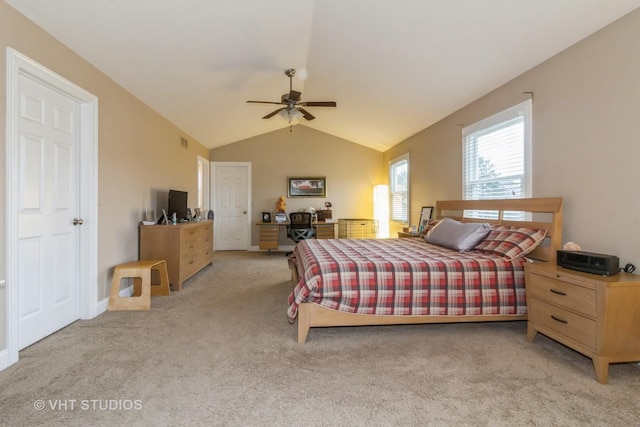 bedroom with ceiling fan, light colored carpet, and lofted ceiling