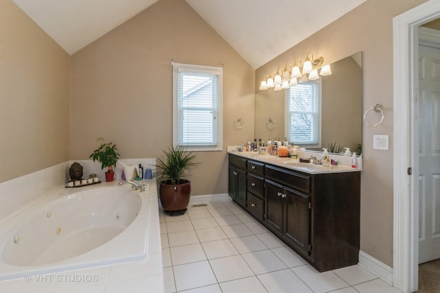 bathroom with tiled bath, tile patterned flooring, vanity, and vaulted ceiling