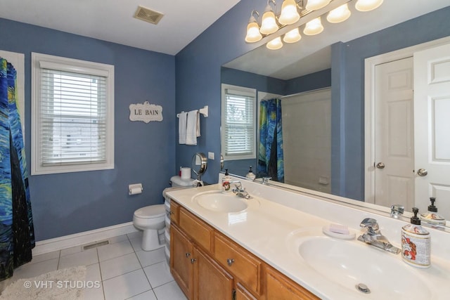 bathroom featuring toilet, a shower with curtain, vanity, and tile patterned floors