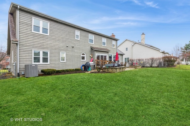 back of property with a yard, a patio, and cooling unit