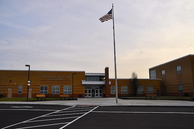 view of outdoor building at dusk