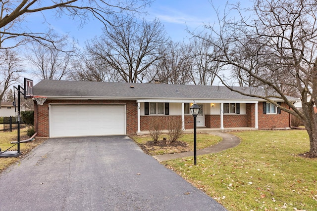 single story home with a front yard and a garage